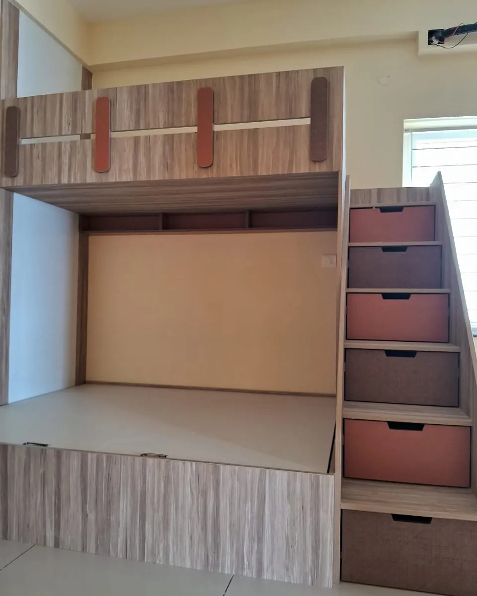 Raised bed platform with a staircase of storage drawers