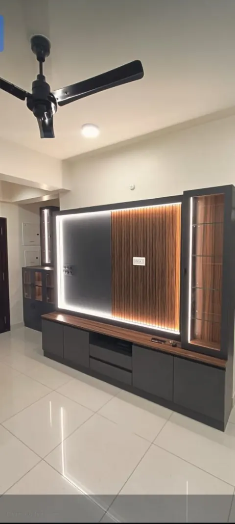 TV wall with a backlit panel and a low cabinet