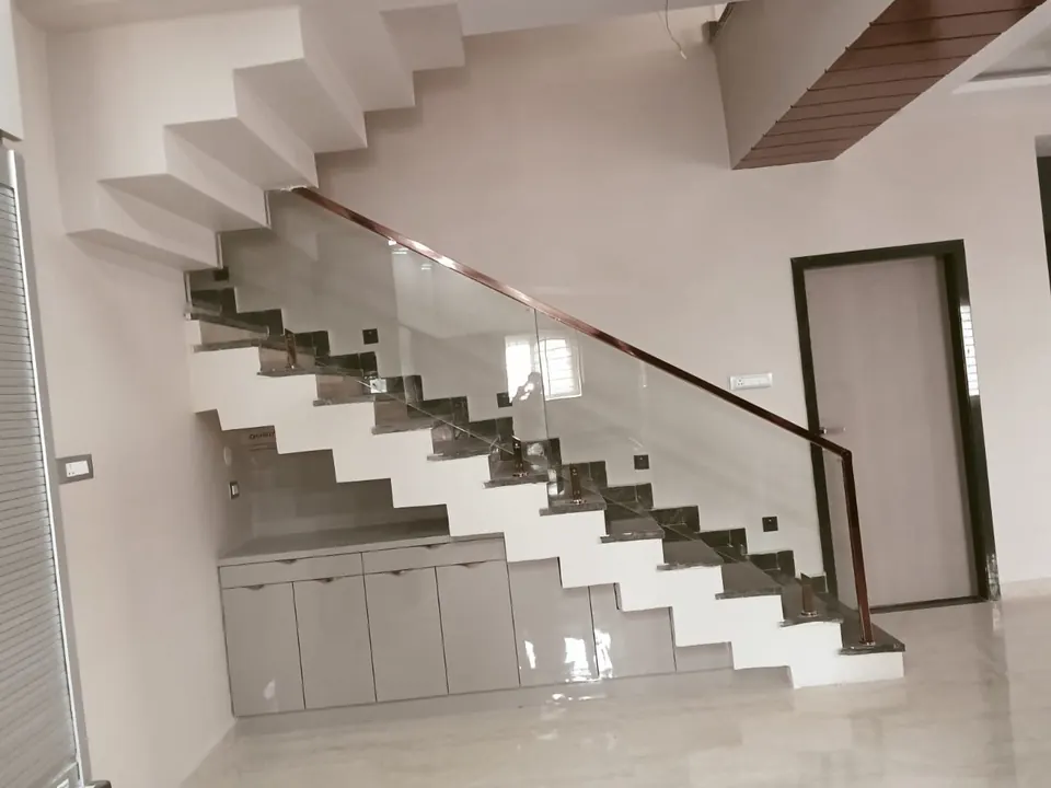 Cabinets fitted into the space under a staircase